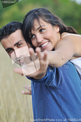 Image of happy young couple have romantic time outdoor
