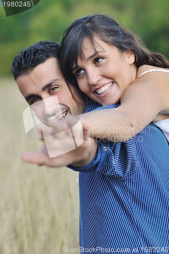Image of happy young couple have romantic time outdoor