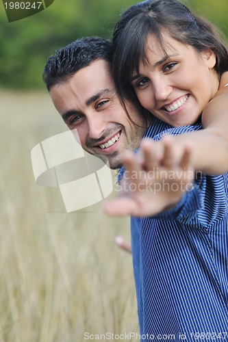 Image of happy young couple have romantic time outdoor