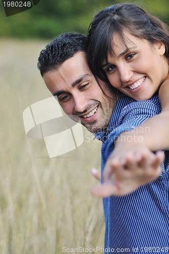 Image of happy young couple have romantic time outdoor