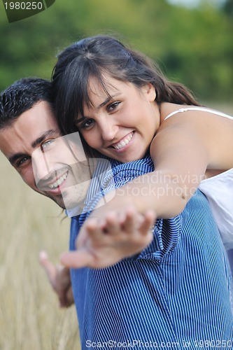 Image of happy young couple have romantic time outdoor