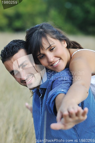 Image of happy young couple have romantic time outdoor