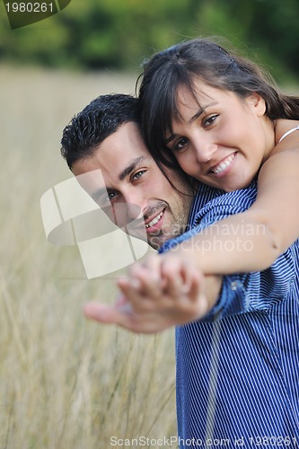 Image of happy young couple have romantic time outdoor