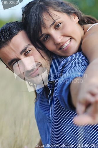 Image of happy young couple have romantic time outdoor