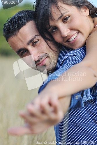 Image of happy young couple have romantic time outdoor