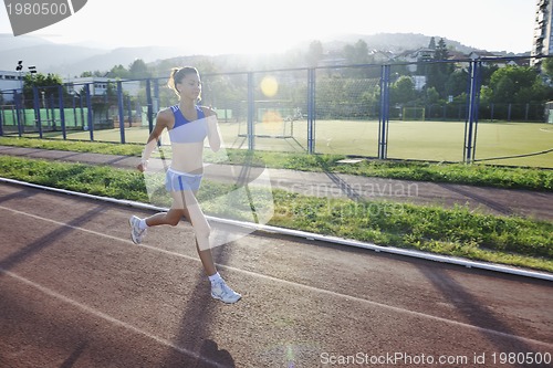 Image of woman jogging at early morning 