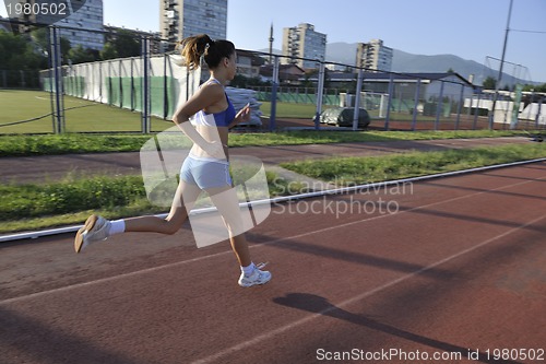 Image of woman jogging at early morning 