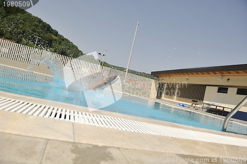 Image of beautiful woman relax on swimming pool
