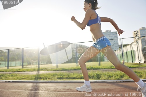 Image of woman jogging at early morning