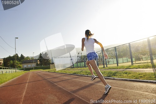 Image of woman jogging at early morning 