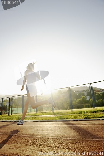 Image of woman jogging at early morning