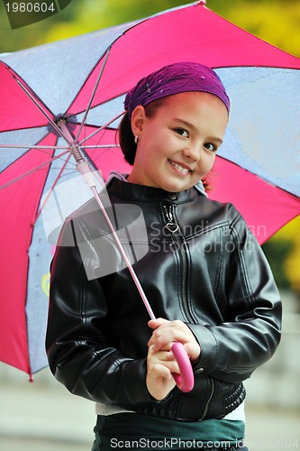 Image of happy girl with umbrella