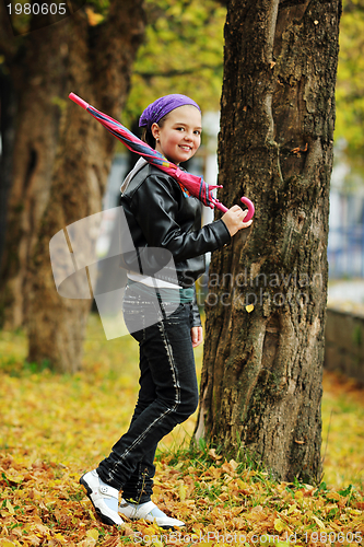 Image of happy girl with umbrella