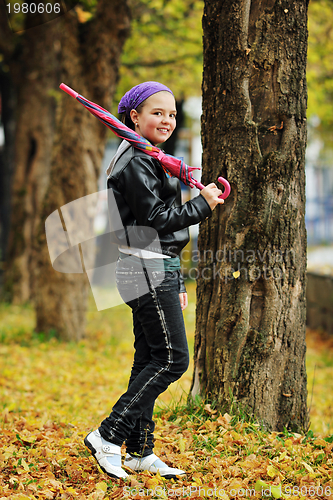 Image of happy girl with umbrella