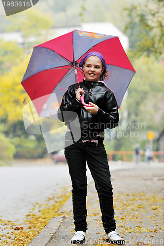 Image of happy girl with umbrella