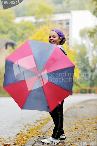 Image of happy girl with umbrella