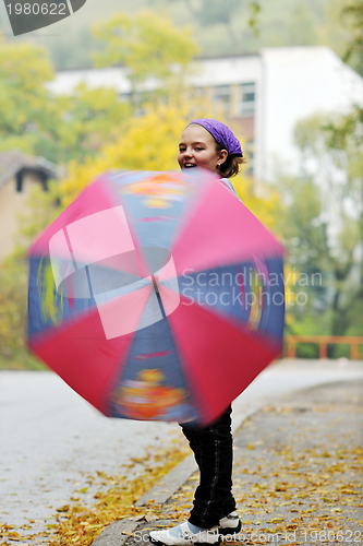 Image of happy girl with umbrella