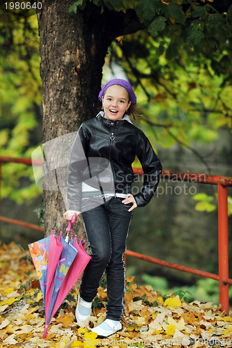 Image of happy girl with umbrella