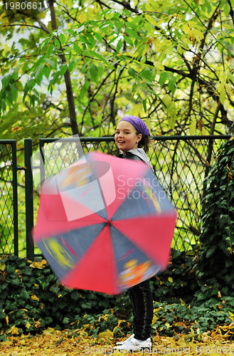 Image of happy girl with umbrella