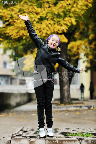 Image of happy girl with umbrella