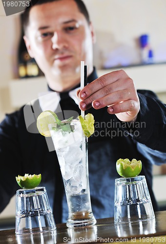 Image of pro barman prepare coctail drink on party