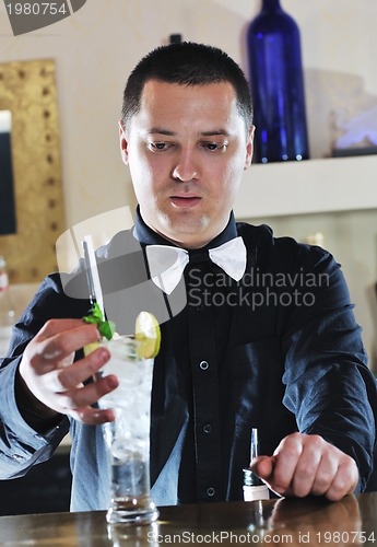 Image of pro barman prepare coctail drink on party