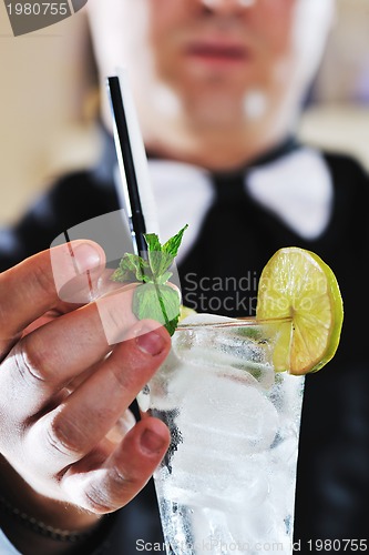 Image of pro barman prepare coctail drink on party