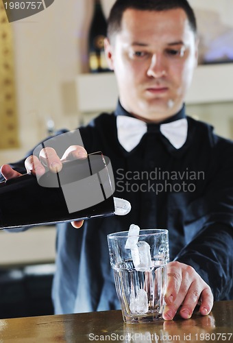 Image of pro barman prepare coctail drink on party