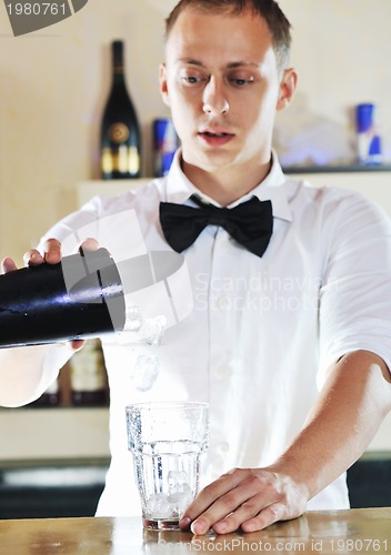 Image of pro barman prepare coctail drink on party