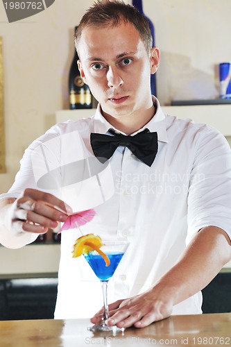 Image of pro barman prepare coctail drink on party