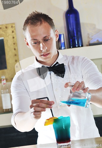 Image of pro barman prepare coctail drink on party