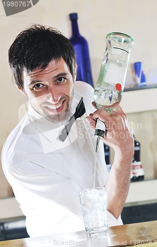 Image of pro barman prepare coctail drink on party