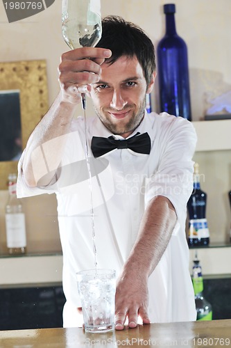 Image of pro barman prepare coctail drink on party