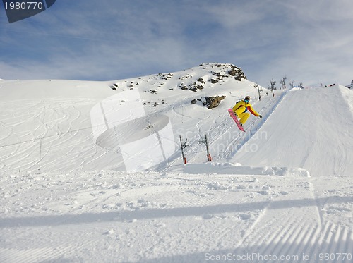 Image of happy young man have fun at winter on mountain peak
