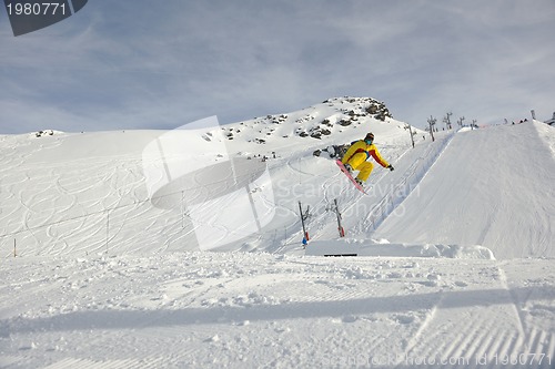 Image of snowboarder extreme jump