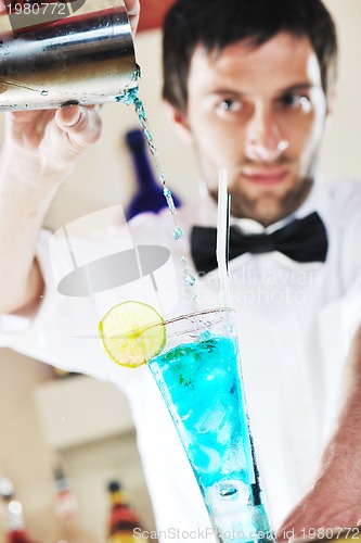 Image of pro barman prepare coctail drink on party