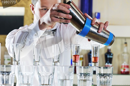 Image of pro barman prepare coctail drink on party