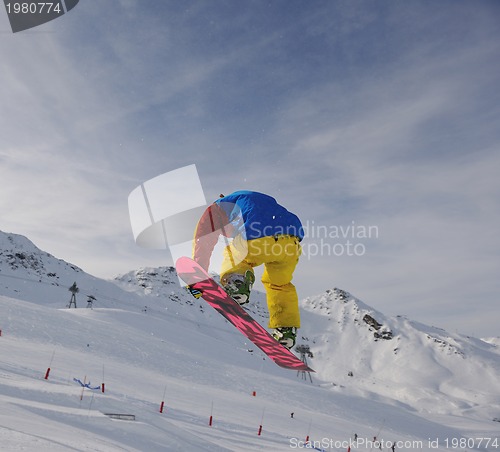 Image of snowboarder extreme jump