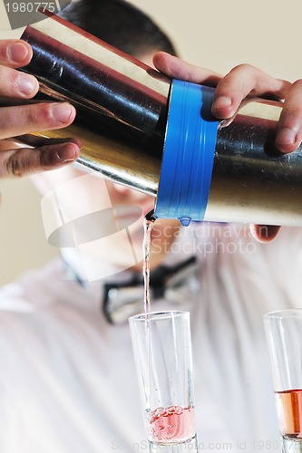 Image of pro barman prepare coctail drink on party