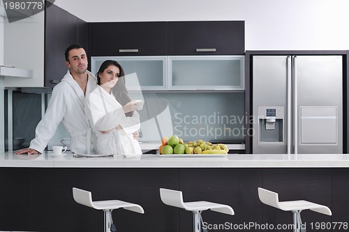 Image of young couple have fun in modern kitchen