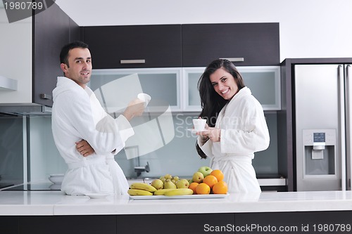 Image of young couple have fun in modern kitchen