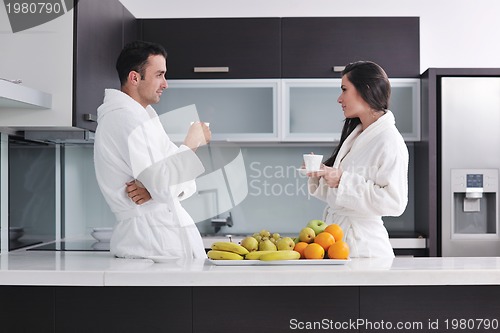 Image of young couple have fun in modern kitchen