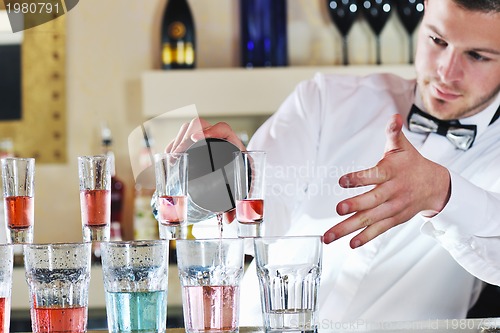 Image of pro barman prepare coctail drink on party