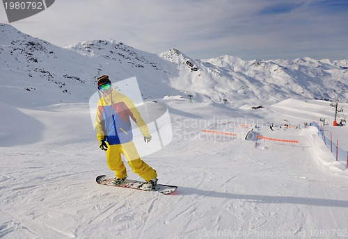 Image of happy young man have fun at winter on mountain peak