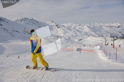 Image of snowboarder extreme jump