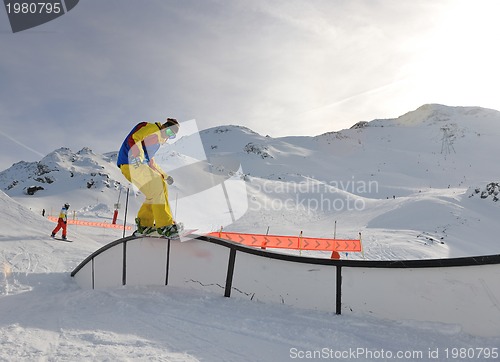 Image of happy young man have fun at winter on mountain peak