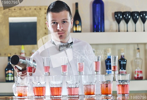 Image of pro barman prepare coctail drink on party