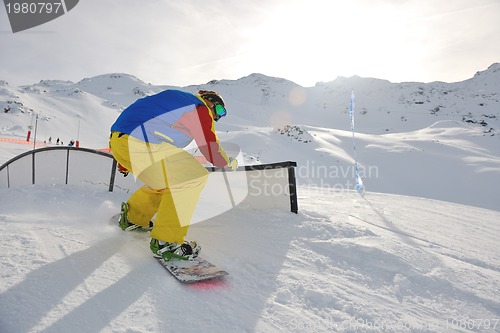 Image of snowboarder extreme jump