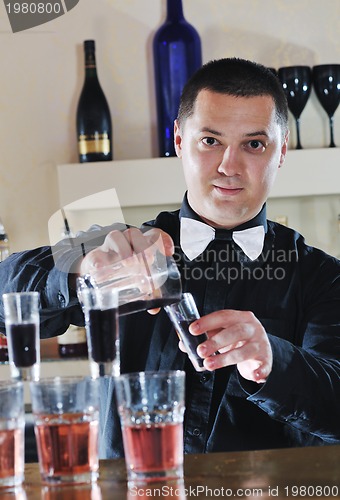 Image of pro barman prepare coctail drink on party