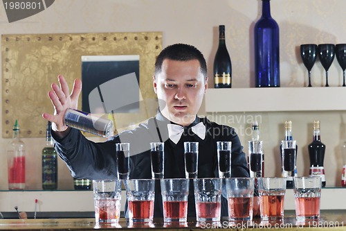 Image of pro barman prepare coctail drink on party